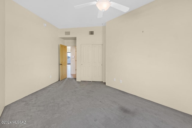 empty room with carpet flooring and ceiling fan