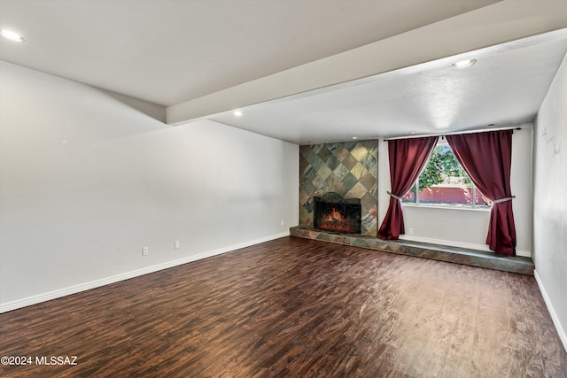 unfurnished living room featuring a fireplace and hardwood / wood-style floors