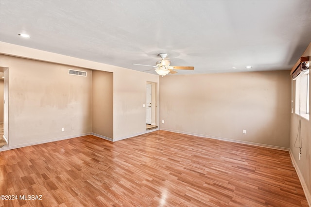 unfurnished room with ceiling fan and light hardwood / wood-style floors