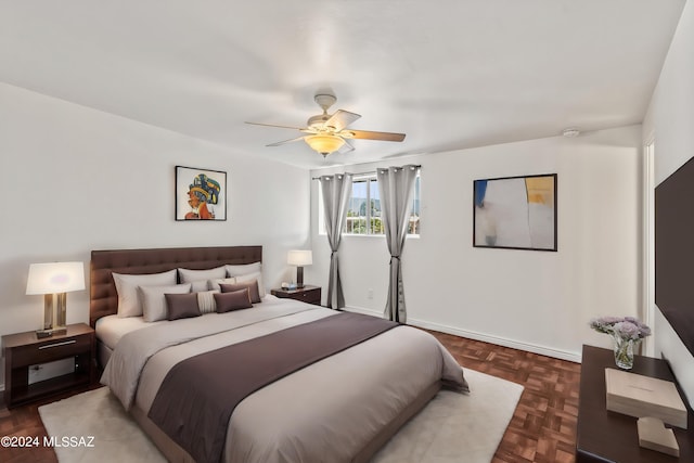 bedroom featuring dark parquet flooring and ceiling fan