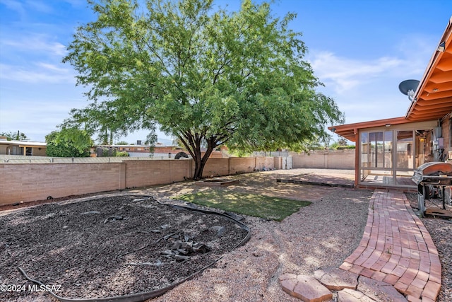 view of yard with a sunroom