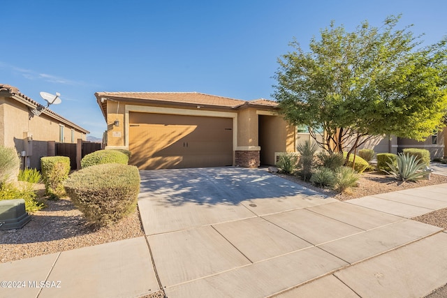 6551 E Via Arroyo Largo, Tucson, AZ 85756 - view of front of house featuring driveway, a garage, stucco siding, and a tile roof