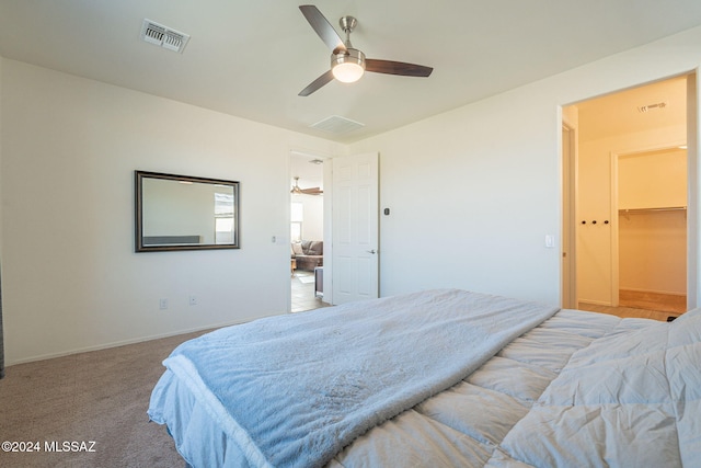 6551 E Via Arroyo Largo, Tucson, AZ 85756 - bedroom with a ceiling fan, baseboards, light carpet, and a spacious closet