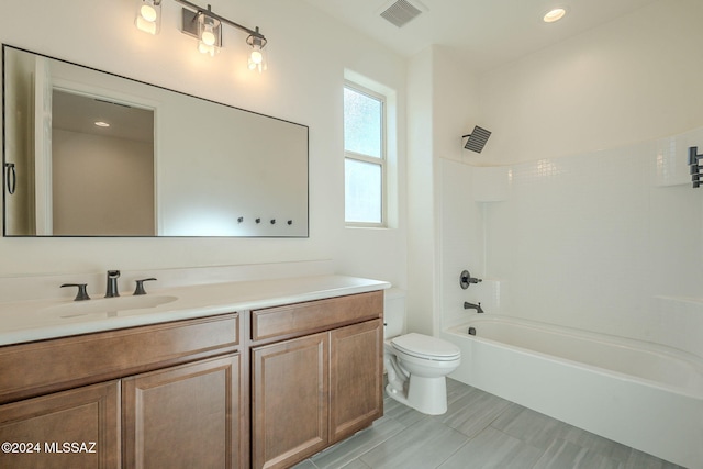 6551 E Via Arroyo Largo, Tucson, AZ 85756 - bathroom featuring toilet, vanity, and shower / bathtub combination