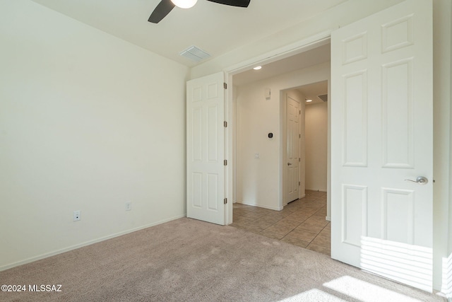 6551 E Via Arroyo Largo, Tucson, AZ 85756 - carpeted spare room featuring ceiling fan, tile patterned floors, and baseboards