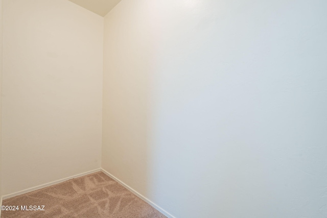 6551 E Via Arroyo Largo, Tucson, AZ 85756 - spare room featuring light carpet and baseboards