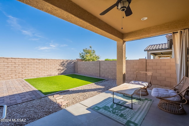 6551 E Via Arroyo Largo, Tucson, AZ 85756 - fenced backyard featuring a ceiling fan and a patio