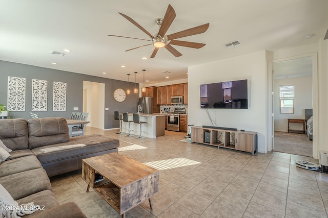 6551 E Via Arroyo Largo, Tucson, AZ 85756 - living area featuring ceiling fan, light tile patterned floors, and recessed lighting