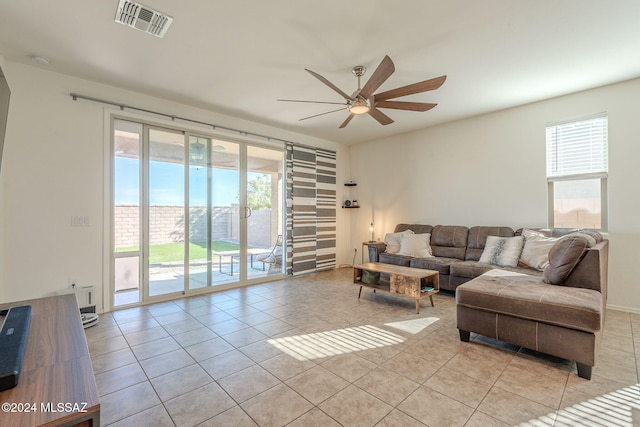 6551 E Via Arroyo Largo, Tucson, AZ 85756 - living room featuring light tile patterned floors and ceiling fan