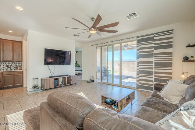 6551 E Via Arroyo Largo, Tucson, AZ 85756 - living area with a ceiling fan, light tile patterned floors, and recessed lighting