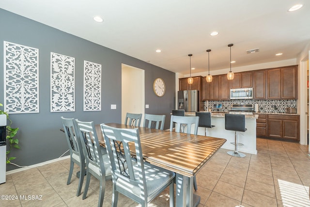 6551 E Via Arroyo Largo, Tucson, AZ 85756 - dining space featuring light tile patterned floors and recessed lighting