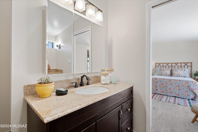 bathroom with vanity and vaulted ceiling