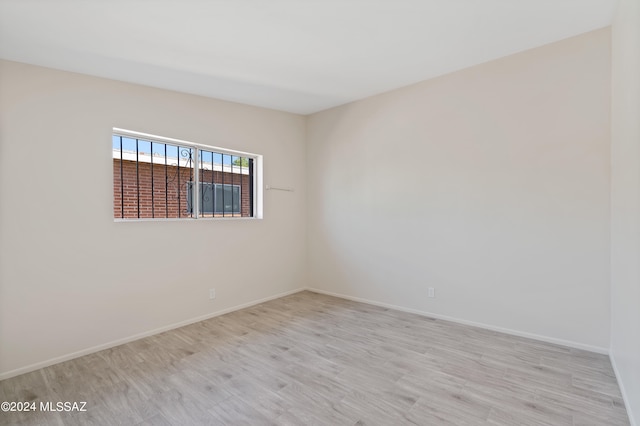 spare room featuring light hardwood / wood-style floors