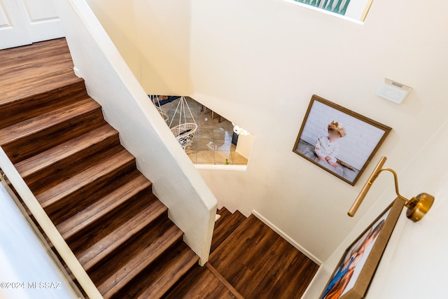 stairs with hardwood / wood-style flooring