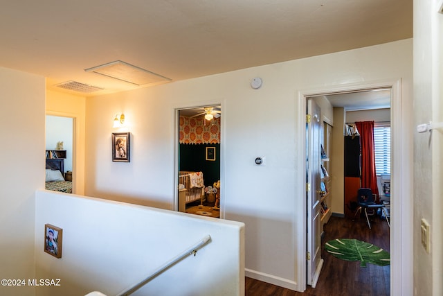 corridor featuring dark hardwood / wood-style flooring