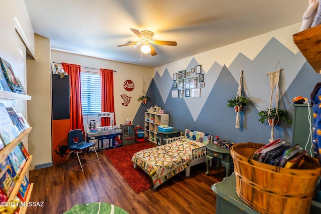 game room with ceiling fan and dark hardwood / wood-style floors