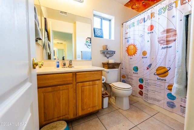 bathroom featuring tile patterned flooring, vanity, toilet, and a shower with shower curtain