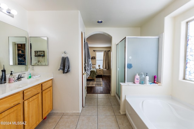 bathroom featuring vanity, tile patterned floors, and separate shower and tub