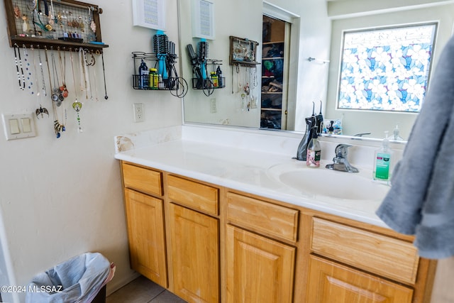 bathroom with tile patterned flooring and vanity