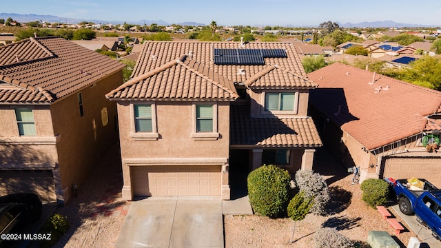 birds eye view of property featuring a mountain view