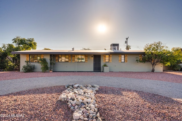 single story home with central AC unit