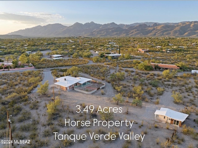 birds eye view of property featuring a mountain view