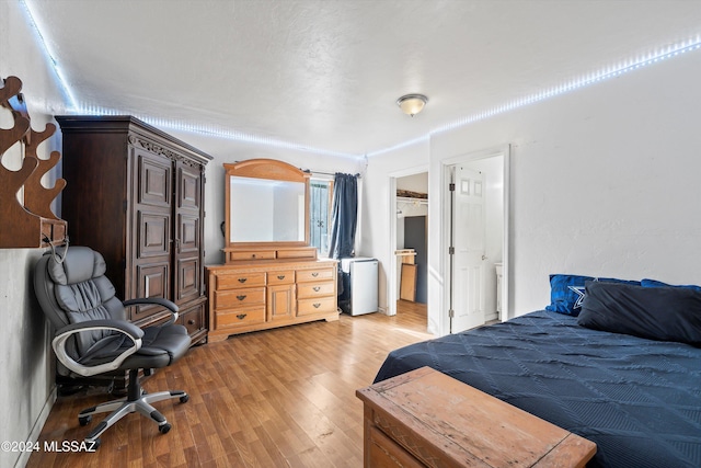 bedroom with light hardwood / wood-style floors