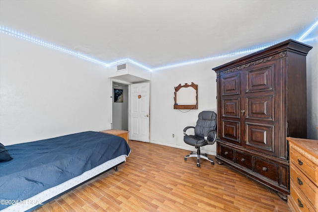 bedroom with light hardwood / wood-style flooring