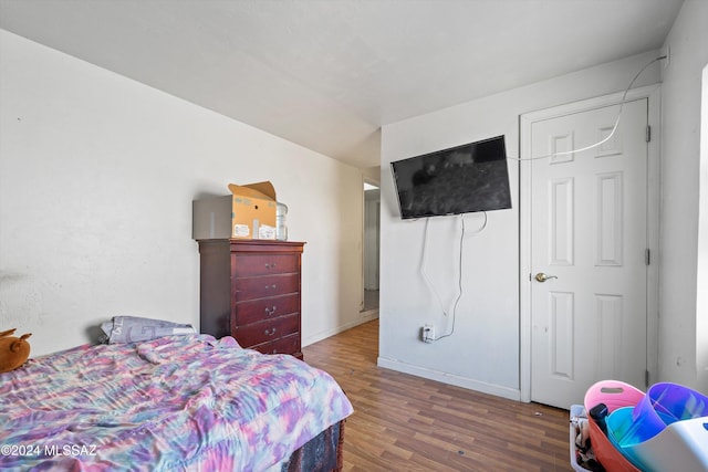 bedroom featuring dark hardwood / wood-style flooring