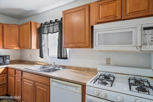 kitchen with white appliances and sink