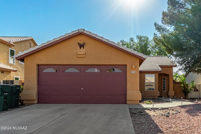 view of front of property featuring a garage