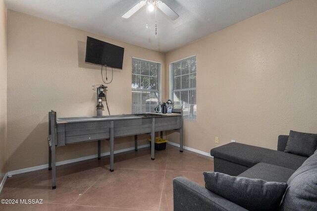 office space with tile patterned floors and ceiling fan