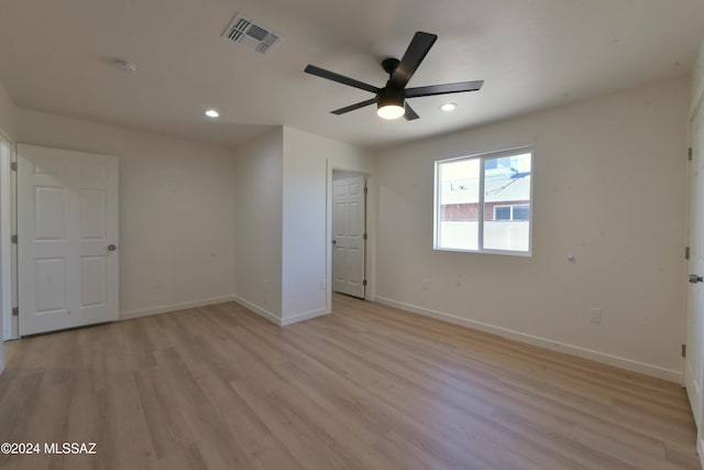 unfurnished bedroom with light hardwood / wood-style floors and ceiling fan