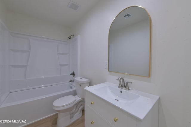 full bathroom with vanity, hardwood / wood-style flooring, toilet, and tub / shower combination