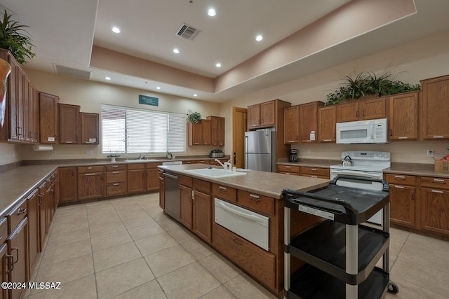 kitchen featuring light tile patterned floors, sink, and appliances with stainless steel finishes