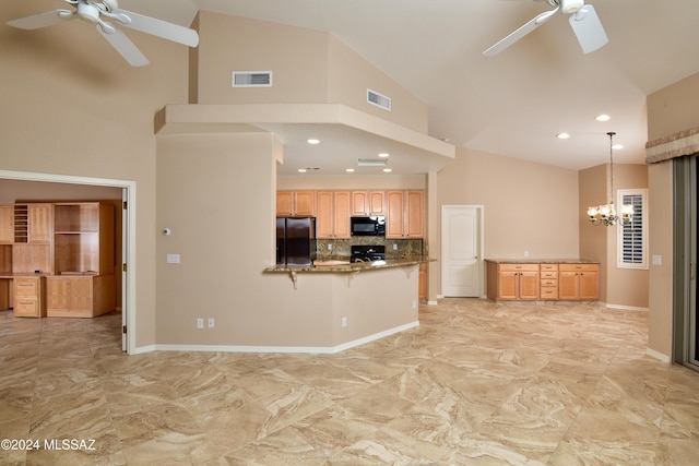 kitchen with kitchen peninsula, ceiling fan with notable chandelier, black appliances, high vaulted ceiling, and hanging light fixtures