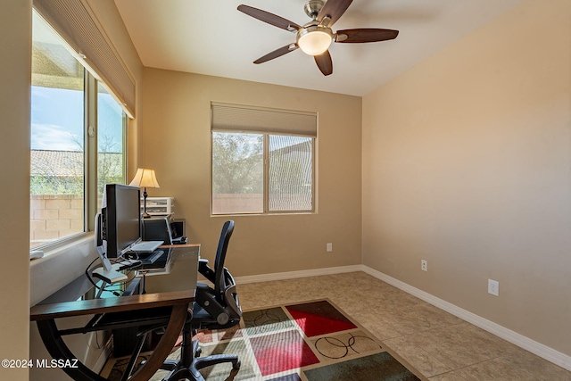 office area featuring ceiling fan, baseboards, and tile patterned floors