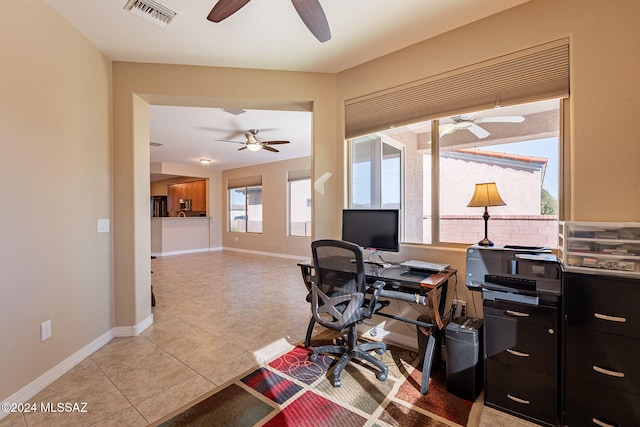 office area featuring baseboards, visible vents, ceiling fan, and light tile patterned flooring