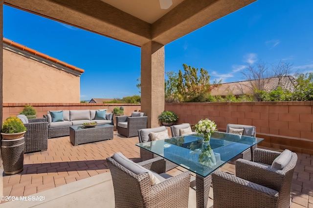 view of patio / terrace featuring outdoor dining area, a fenced backyard, and an outdoor hangout area