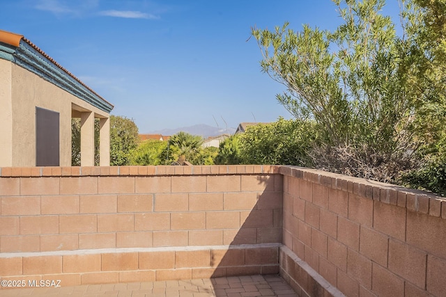 view of patio / terrace featuring fence