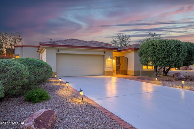4594 S Moon River Pl, Green Valley, AZ 85622 - ranch-style home with stucco siding, concrete driveway, an attached garage, and a tiled roof