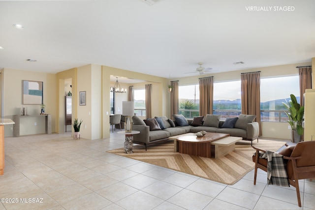 4594 S Moon River Pl, Green Valley, AZ 85622 - living area featuring light tile patterned floors, a chandelier, ceiling fan, and recessed lighting