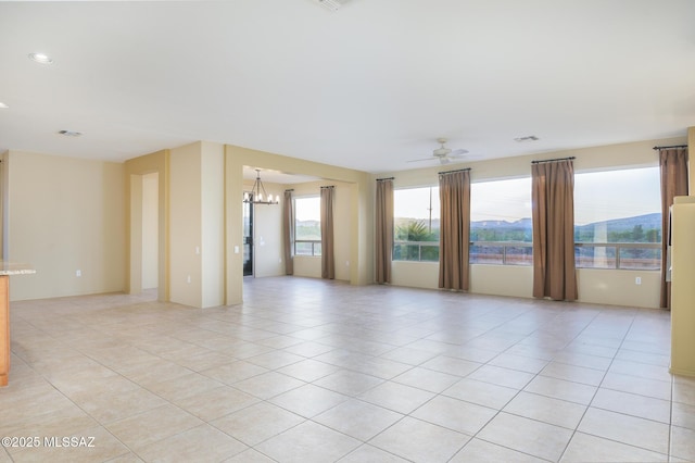 4594 S Moon River Pl, Green Valley, AZ 85622 - empty room featuring a chandelier, a ceiling fan, and light tile patterned flooring