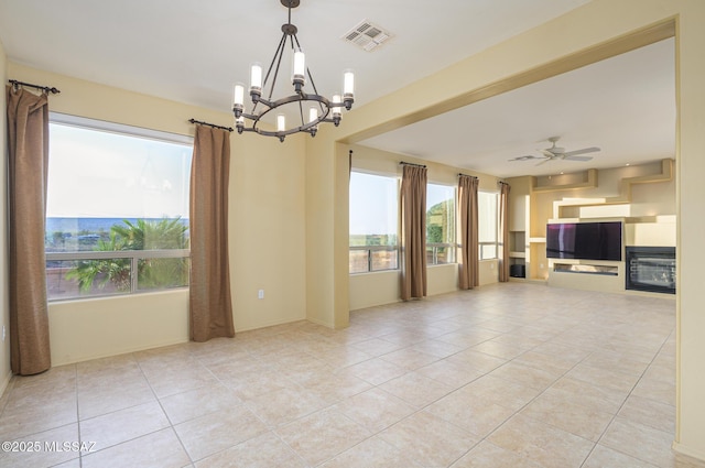 4594 S Moon River Pl, Green Valley, AZ 85622 - unfurnished living room with a chandelier, plenty of natural light, and light tile patterned floors