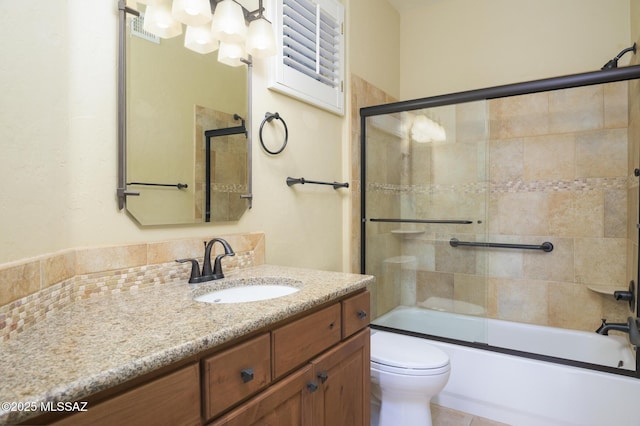 4594 S Moon River Pl, Green Valley, AZ 85622 - bathroom featuring vanity and combined bath / shower with glass door