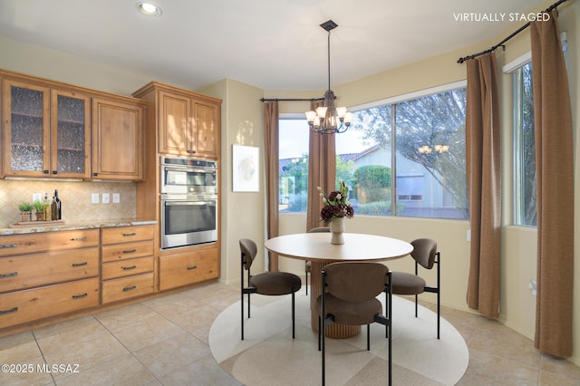 4594 S Moon River Pl, Green Valley, AZ 85622 - dining room with a chandelier, light tile patterned floors, and recessed lighting