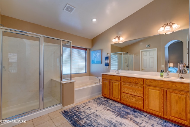 bathroom featuring visible vents, tile patterned floors, vaulted ceiling, a shower stall, and a bath