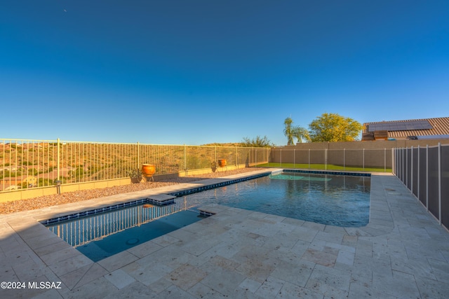 view of swimming pool featuring a fenced in pool, a patio area, and a fenced backyard