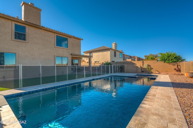 view of swimming pool with a fenced backyard and a fenced in pool