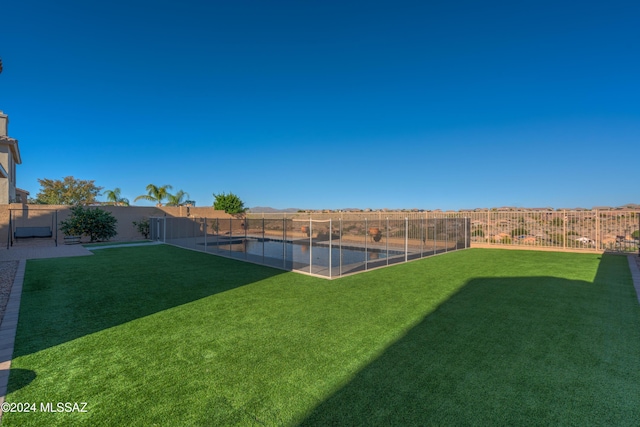 view of yard with a fenced backyard